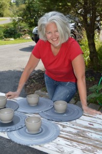 K Robertson-drying pots on a sunny day outside studio